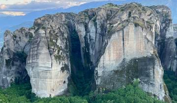 Towering rock formations with vegetation.