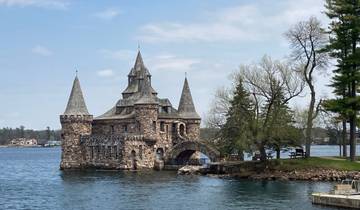 Castle-like building on a small island surrounded by water.