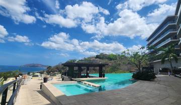 Luxurious resort with an infinity pool overlooking the ocean.