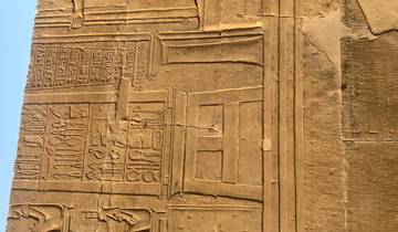 Ancient Egyptian wall carvings with hieroglyphs.