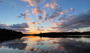Beautiful sunset over a lake with colorful clouds.