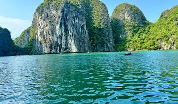 Scenic view of green waters and limestone cliffs.