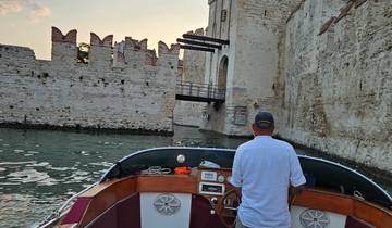 Boat approaching a fortification wall from the water