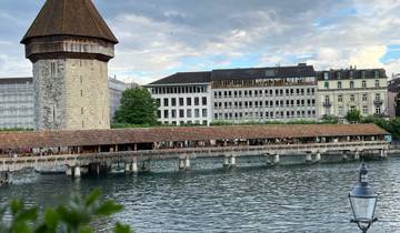 Historic wooden bridge over a water canal.
