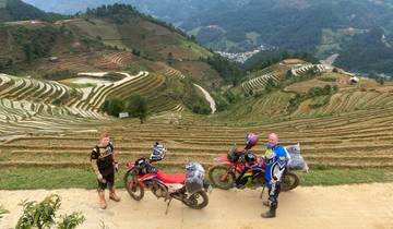 Motorcyclists overlooking terraced rice fields