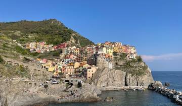 Colorful cliffside village overlooking a rocky shore