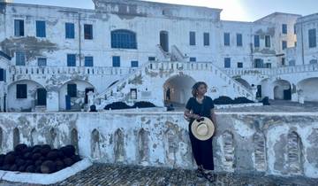 Woman in front of Cape Coast Castle.