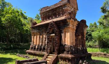 Ancient brick temple surrounded by trees.