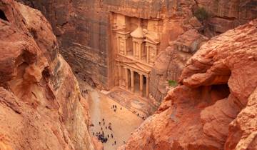 Treasury of Petra carved into red rock cliffs.