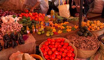 Colorful array of fruits and vegetables at a market stall.