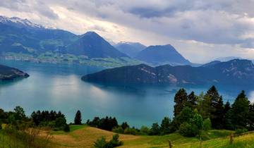 Panoramic view of mountains and a lake with villages.