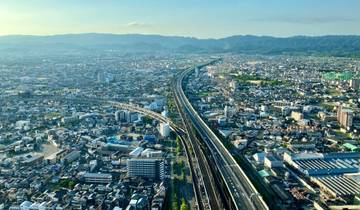 Aerial view of a city with a network of roads.