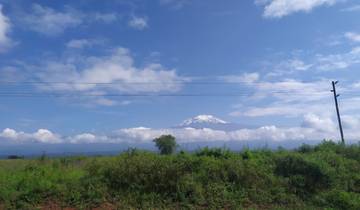 Distant view of Mount Kilimanjaro with clear skies.