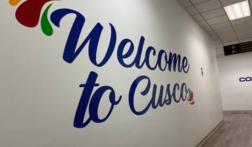 Large welcome sign for Cusco on a wall