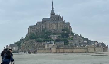 Medieval abbey on an island at low tide.