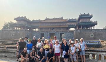Large group of people in front of a historic building.