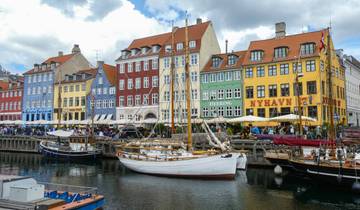 Colorful buildings along the waterfront with docked boats.