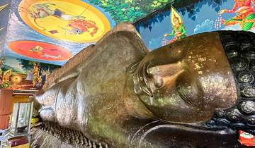 Reclining Buddha statue inside a temple.