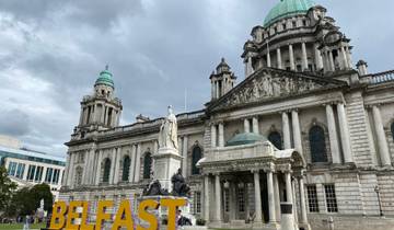 Stately neoclassical building with green domes labeled 'Belfast'.