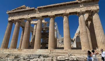 The Parthenon on the Acropolis with people in the foreground.