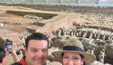 Couple in front of the Terracotta Army excavation site.