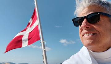 Person with a flag in the background.