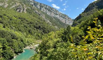 Scenic valley with a river and mountains.