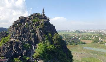 Pagoda atop a rocky mountain with a panoramic view.