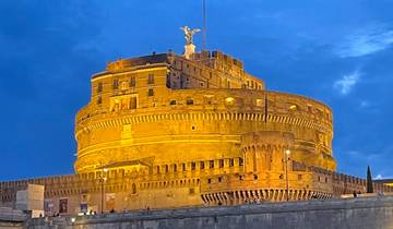 A night view of Castel Sant'Angelo illuminated by lights.