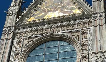 A close-up of a decorative facade with a large window.