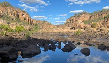 Gorge with rock formations and a river.