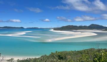 Stunning view of the Whitsunday Islands with turquoise waters and white sand.