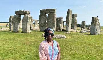 Person in front of Stonehenge.