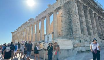 Crowd of people walking near Parthenon in Athens.