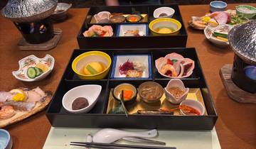 Traditional Japanese meal with assorted dishes.