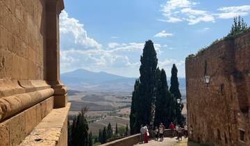 People enjoying a scenic hilltop view in Tuscany.