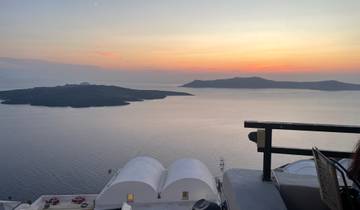 Sunset view over the sea with islands in the distance.