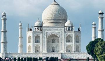 Iconic white marble mausoleum with minarets and a large dome.