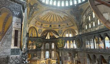 Interior view of a grand historic building with intricate architecture.