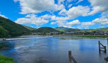 Scenic view of a river with mountains in the background.