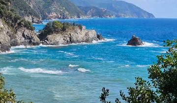 Coastal landscape view with sea and rocky cliffs.