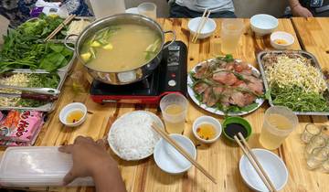 Traditional Vietnamese hotpot meal setup.