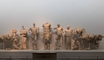 Ancient Greek sculptures on display in a museum.