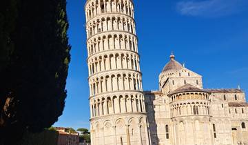 Leaning Tower of Pisa under a clear blue sky.