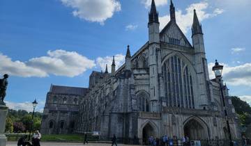 Gothic cathedral with intricate details under a clear sky.
