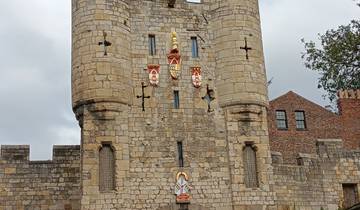 Medieval gate with coats of arms.