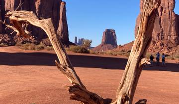 Red desert landscape with towering rock formations.