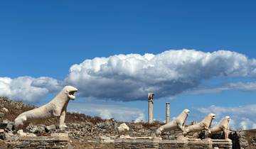 Ancient stone lions on Delos island with a blue sky.