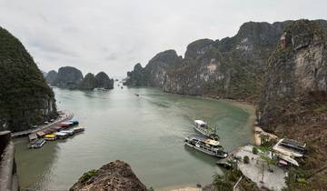Scenic view of Halong Bay with boats and limestone islands.