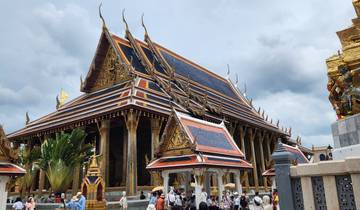 Traditional ornate building with visitors exploring.